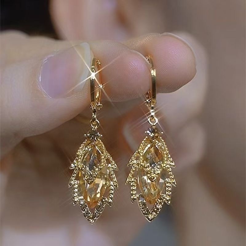 Women's earrings with stem leaf-shaped of golden Zircon elegant