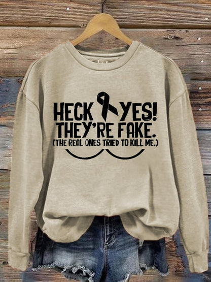 Women's Heck Yes They're Fake The Real One Tried To Kill Me Breast Cancer Awareness Print Sweatshirt