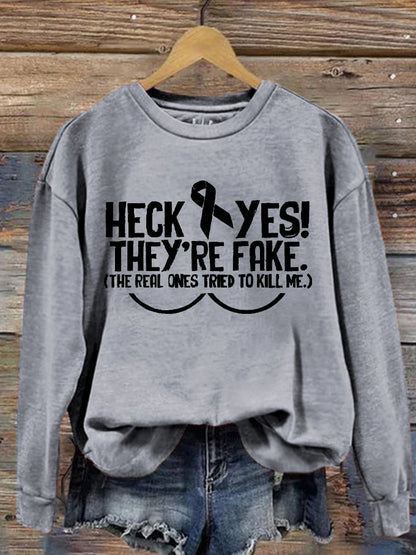 Women's Heck Yes They're Fake The Real One Tried To Kill Me Breast Cancer Awareness Print Sweatshirt