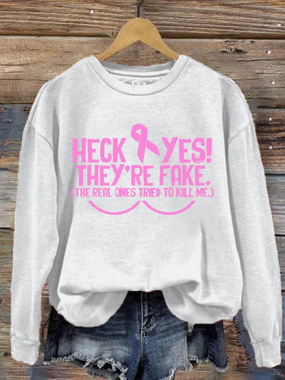 Women's Heck Yes They're Fake The Real One Tried To Kill Me Breast Cancer Awareness Print Sweatshirt